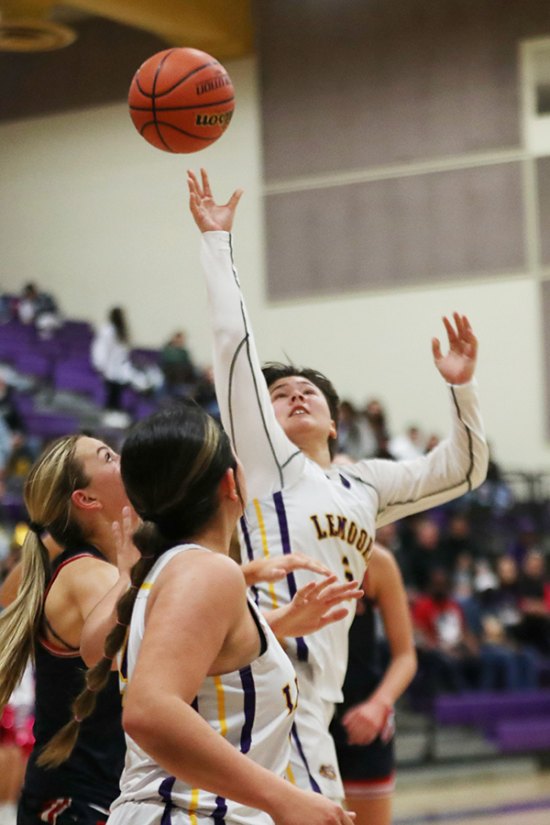 Amber Cole helped lead her team to a 51-48 win over Tulare Western Tuesday night in Lemoore as the Tigers won 51-48.